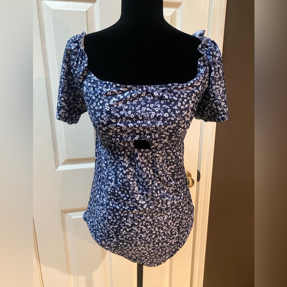 Blue floral one piece bathing suit with short sleeves